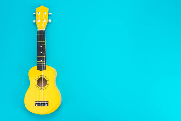 istock Flat lay photo of yellow ukulele with copy space 2165215871