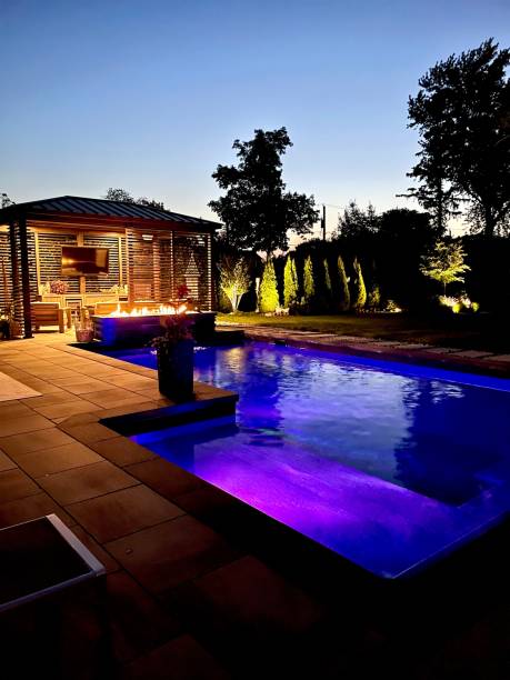 istock Gorgeous modern backyard at night, perfect lighting design and aesthetics 2165218183