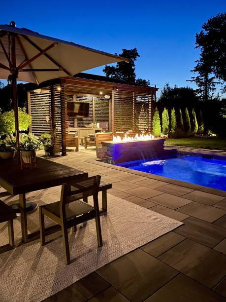 Gorgeous modern backyard at night, perfect lighting design and aesthetics