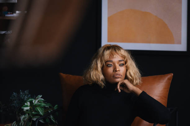 istock Contemplative Black Businesswoman Posing in Modern Office Setting 2165220486