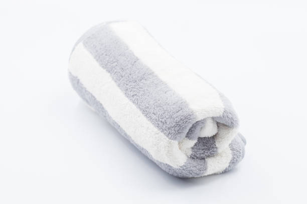 istock Clean bathroom towels laid out in rows, Rolled soft terry towel , Folded soft terry towel. 2165231307