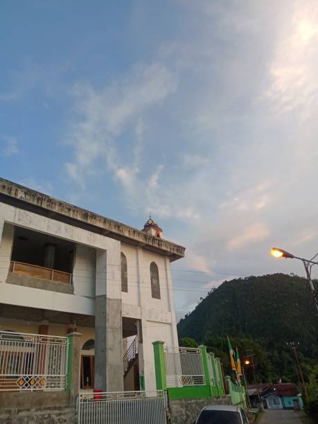 istock mosque building and mountain background 2165232958