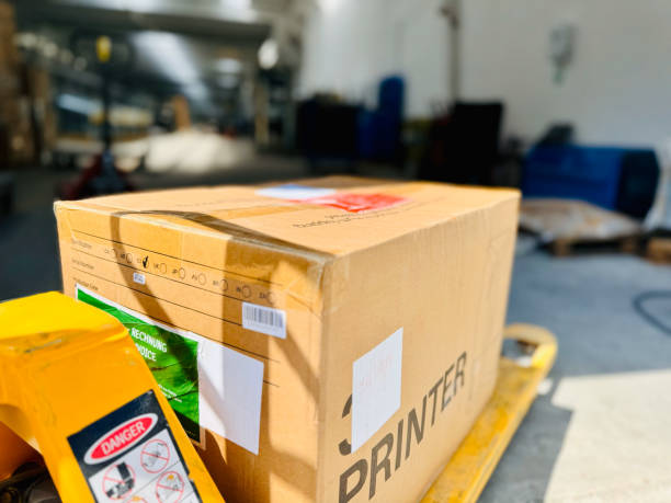 istock Close-Up of 3D Printer Box on Pallet Jack 2165235937