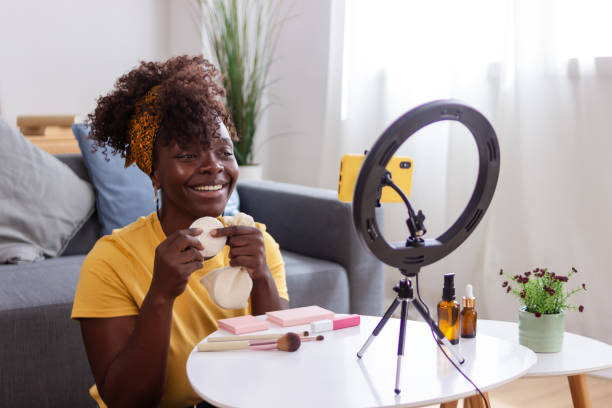 istock Beauty influencer showing reusable makeup remover pads while recording video 2165237563