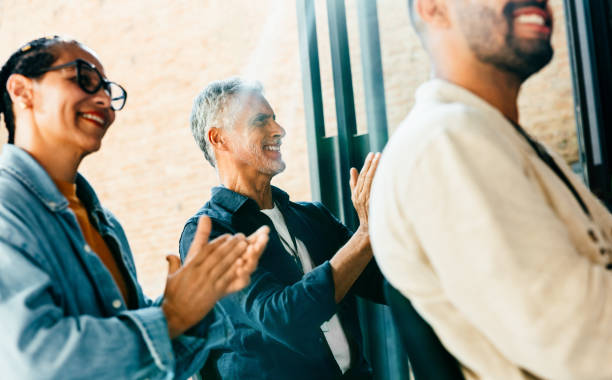 istock Colleagues applauding during a corporate office meeting 2165244066