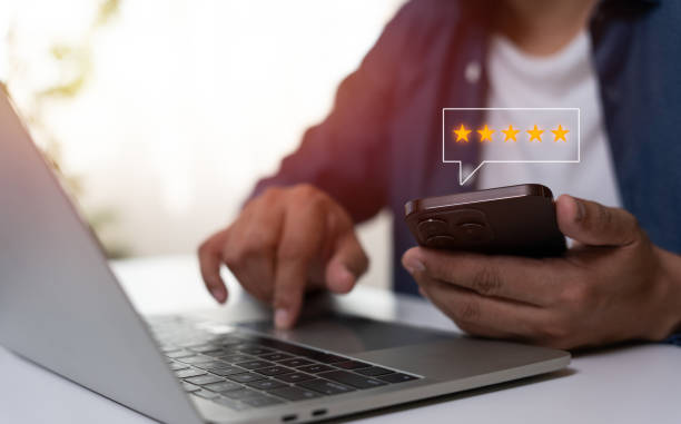 istock User give rating to service experience on online application, Customer can evaluate quality of service leading to reputation ranking of business. Customer review satisfaction feedback survey concept. 2165245155