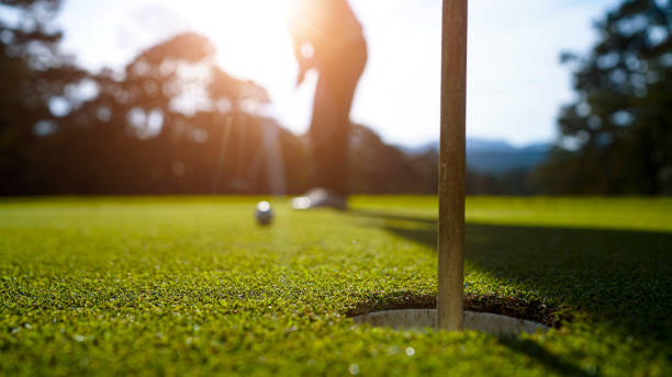 istock Blurred golfers are playing golf in the evening golf course golf backglound. 2165245494