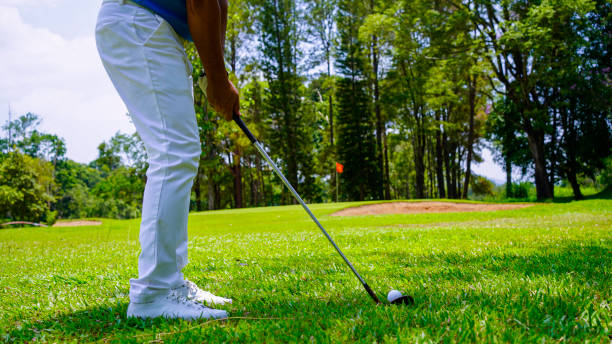 istock Golfers are playing golf in the evening golf course golf backglound. 2165245518