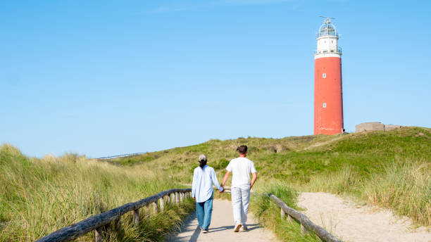 istock Texel Netherlands, Majestic lighthouse towering over the sandy beach on a sunny day 2165245722