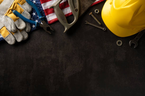 istock Industrial tools on dark background with American flag and hard hat, symbolizing Labor Day in USA 2165250040