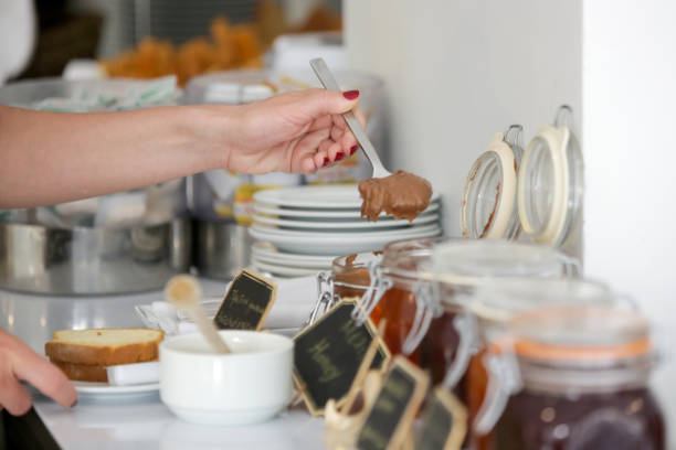 Woman taking food from a buffet line