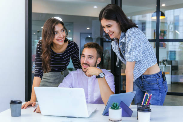 istock Businessmans crew working with new startup project in modern Office. Group of diverse businesspeople working together around a meeting table in an office 2165255336