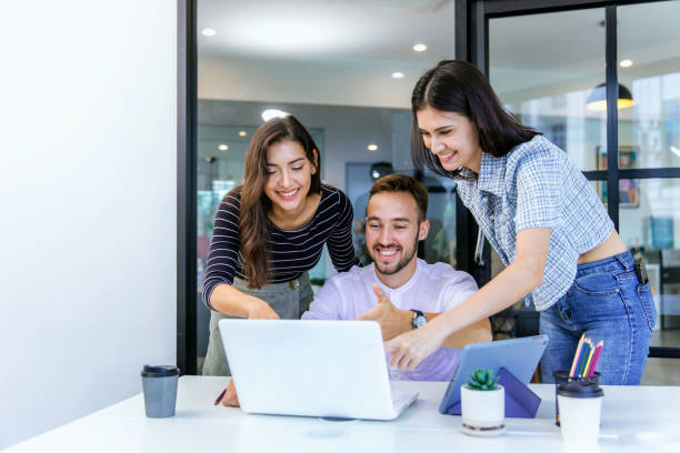 istock Businessmans crew working with new startup project in modern Office. Group of diverse businesspeople working together around a meeting table in an office 2165255338