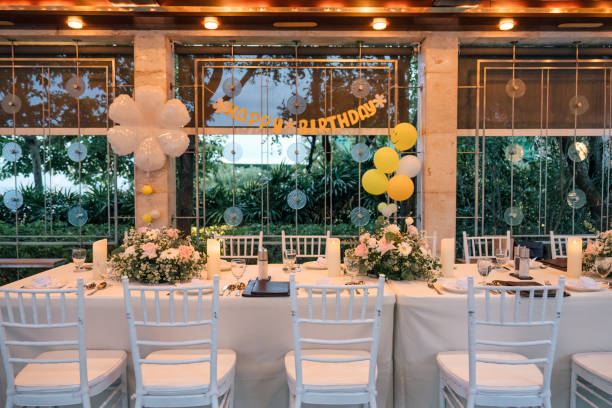istock Setting up a banquet dining table for a birthday celebration, decor in restaurant 2165257376