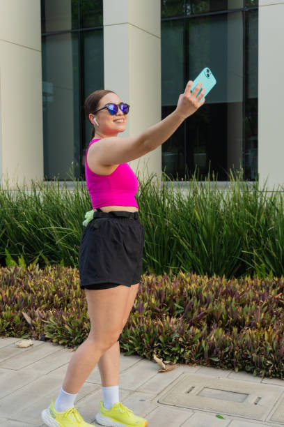 istock Latin Woman Taking a Selfie After Exercise 2165260499
