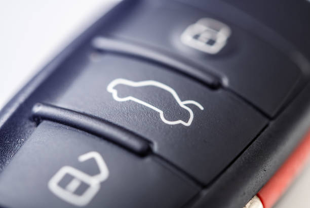 A detailed view of a sleek car key remote, featuring buttons for locking and unlocking doors. The design showcases modern automotive technology and convenience, essential for car owners and enthusiasts.
