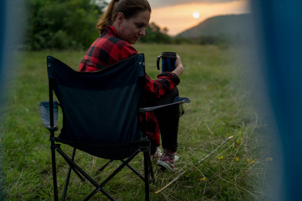 istock Beautiful woman relaxing on camping trip 2165264870