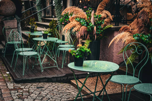 istock Fall sidewalk cafe. Autumn rainy cityscape 2165270483