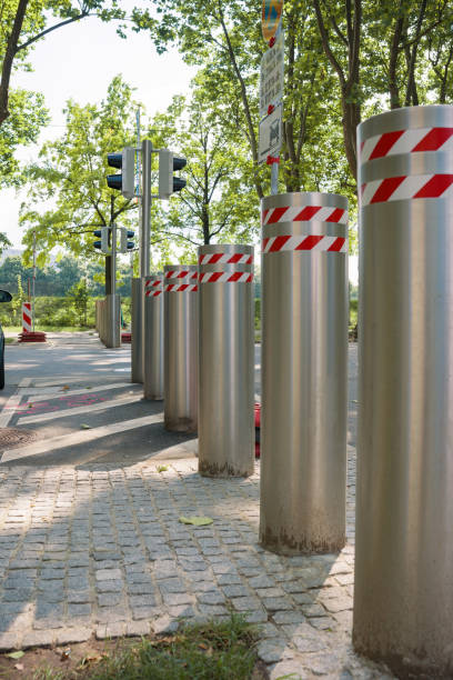 istock iron safety poles that rise from the asphalt 2165271376