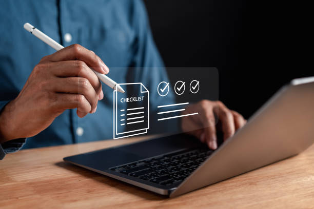 istock Online survey filling out and digital form checklist quality check improvement. Standardization, certification. Compliance to regulations service and standards. 2165272666