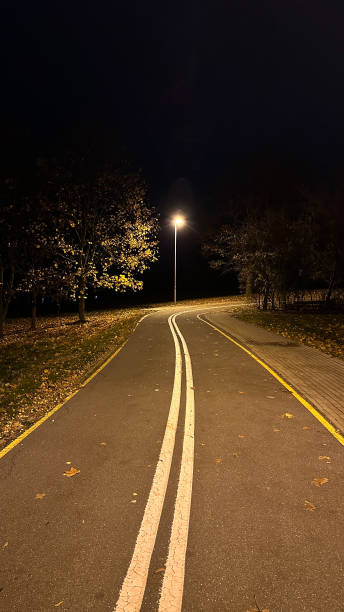 istock road in the night 2165274163