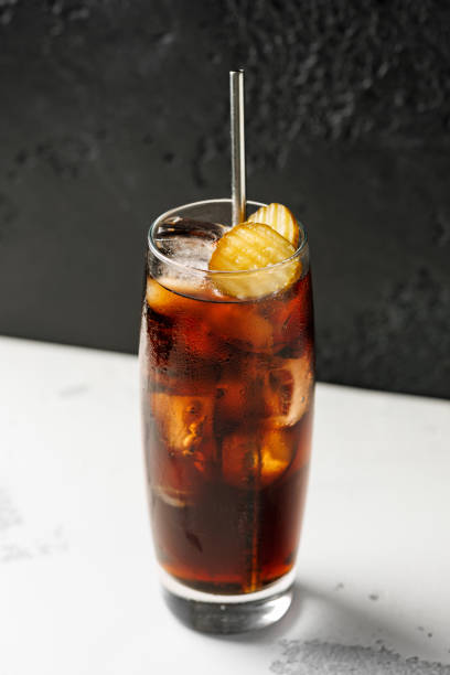 istock Soft drink cola with pickles and ice in a glass. 2165274744
