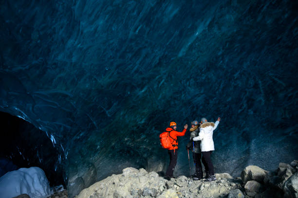 istock Guide leads guests on ice-cave tour 2165282043