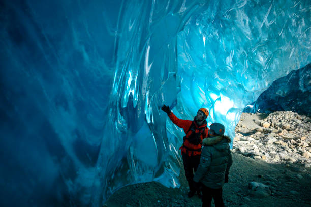 istock Guide leads guests on ice-cave tour 2165282186