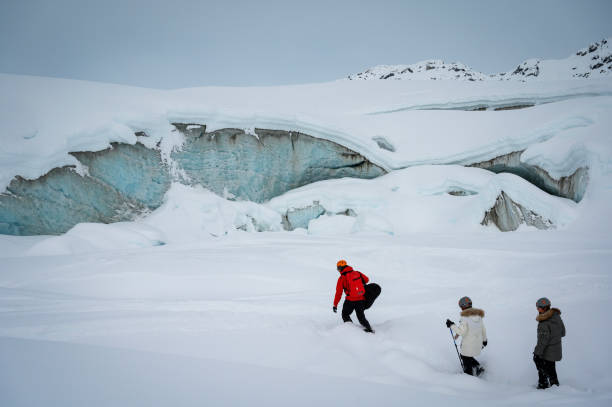 istock Guide leads guests on ice-cave tour 2165282239