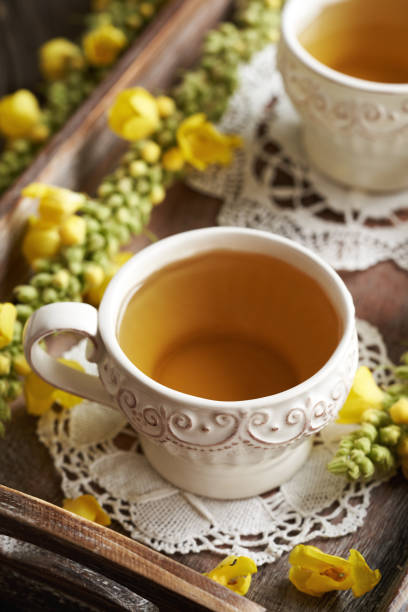 istock Mullein or Verbascum tea against cough in a cup 2165282274