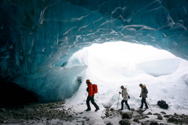 istock Guide leads guests on ice-cave tour 2165282813