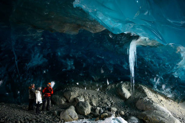 istock Guide leads guests on ice-cave tour 2165282814