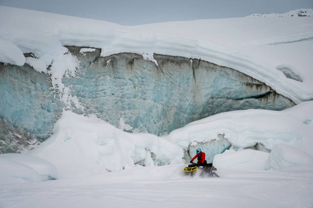 istock Guide and guests on ice-cave tour 2165282867