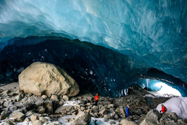 istock Guide leads guests on ice-cave tour 2165282869