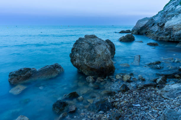 Large rocks over the sea with silk effect