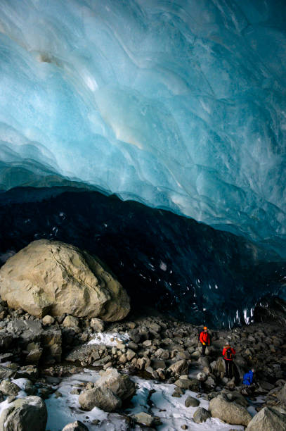 istock Guide leads guests on ice-cave tour 2165282990