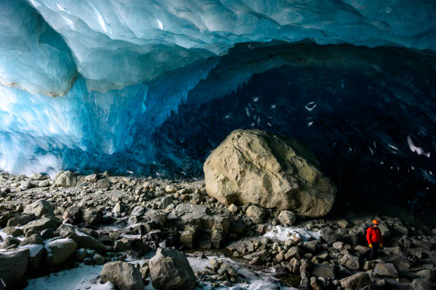istock Guide leads guests on ice-cave tour 2165282997