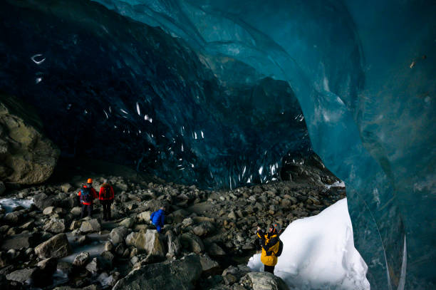 istock Guide leads guests on ice-cave tour 2165283021