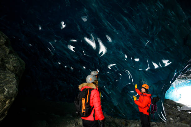 istock Guide leads guests on ice-cave tour 2165283108