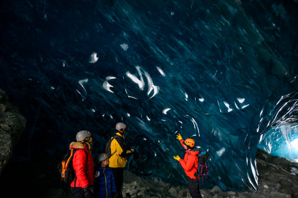 istock Guide leads guests on ice-cave tour 2165283109