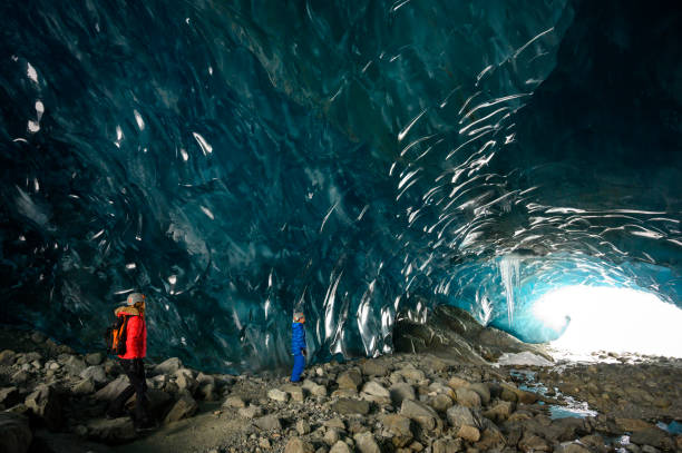 istock Guide leads guests on ice-cave tour 2165283173