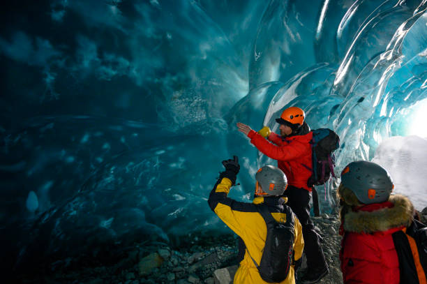Guide leads guests on ice-cave tour