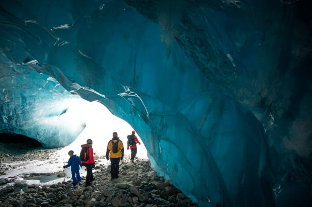 istock Guide leads guests on ice-cave tour 2165283177