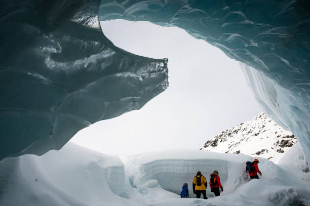istock Guide leads guests on ice-cave tour 2165283212
