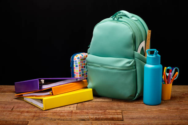 istock Back to School Backpack with a Black Chalkboard and Supplies 2165283723