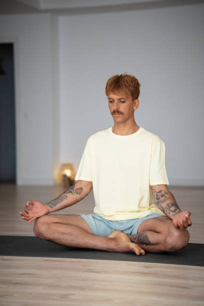 istock Man in deep meditation in lotus yoga position 2165285194