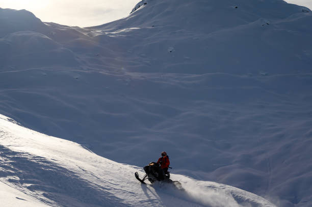 istock Backcountry snowmobiler rides across glacier 2165285320