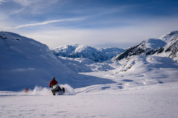 istock Backcountry snowmobiler rides across glacier 2165285480