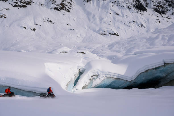 istock Backcountry snowmobiler rides across glacier 2165285698