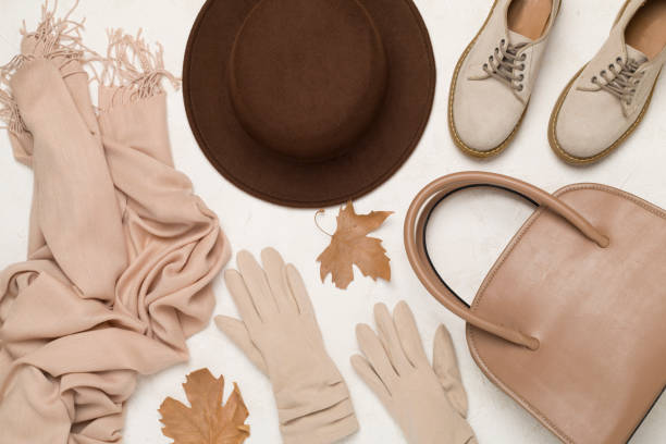istock Stylish autumn accessories on concrete background, top view 2165289317